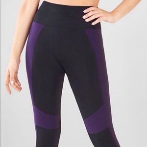 Demi Lovato Fabletics purple and black leggings